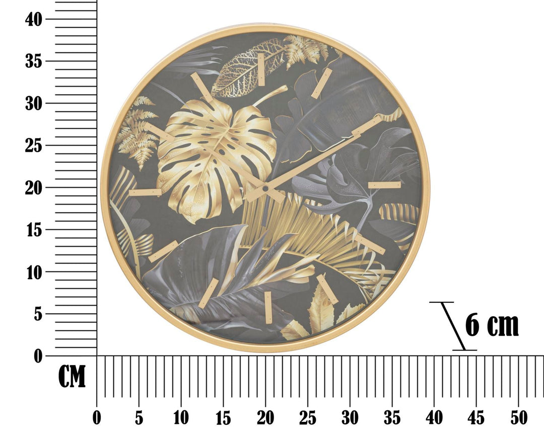 Goldene und graue Wanduhr mit tropischem Blattmuster