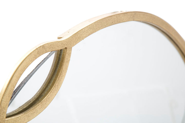 Runder Wandspiegel aus Metall mit minimalistischem Linienmuster