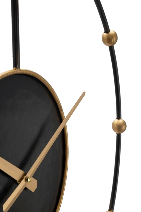 Bronzene und schwarze Wanduhr aus Metall