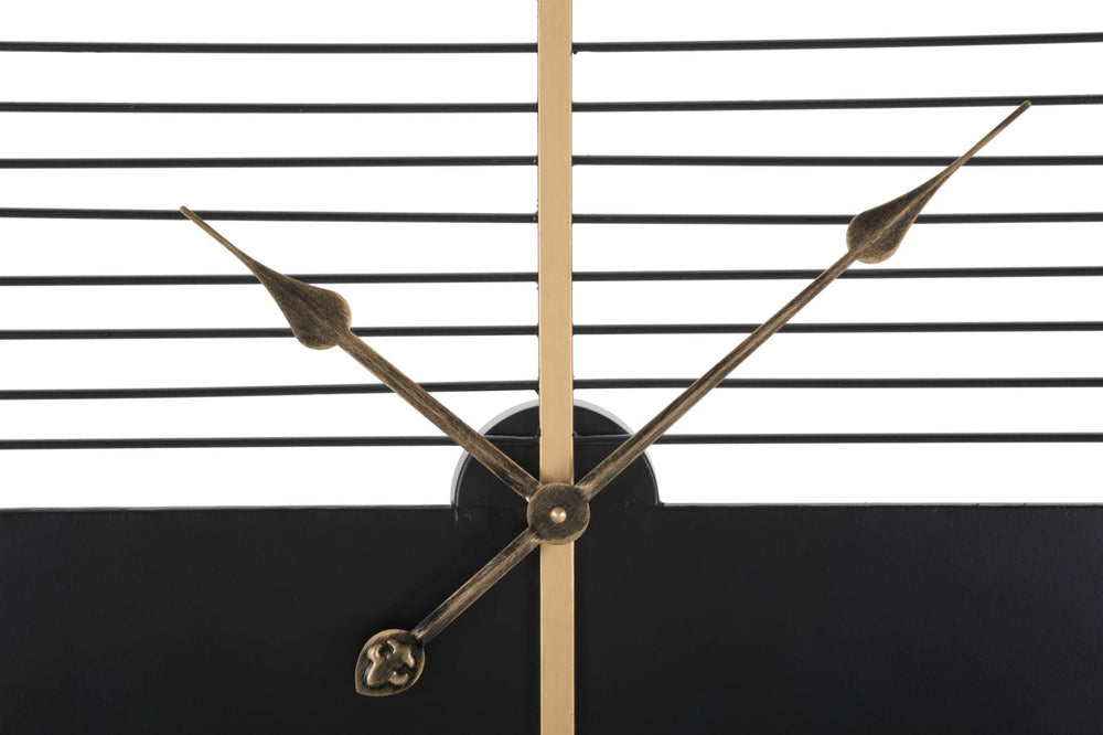 Schwarze und weiße moderne Wanduhr mit geometrischem Muster