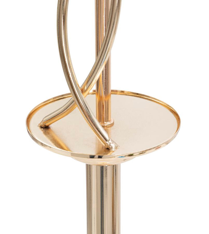 Stehlampe aus goldfarbenem Metall und schwarzem Blättermuster