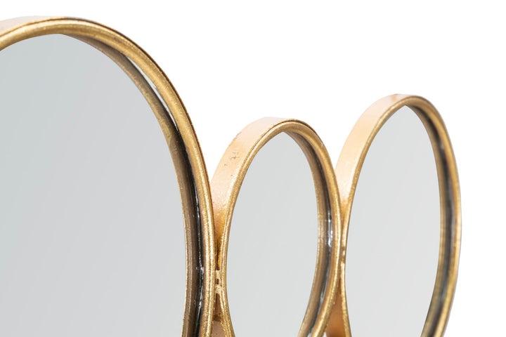 Kleine goldfarbene runde Wanddekoration
