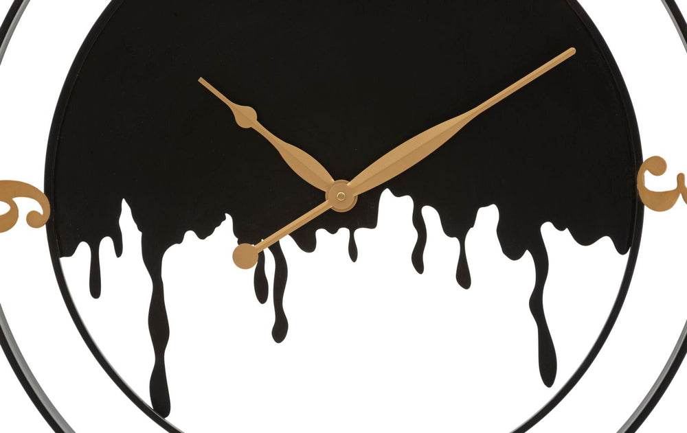 Moderne Wanduhr aus Metall in Gold und Schwarz