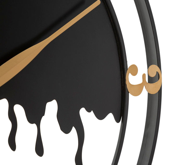 Moderne Wanduhr aus Metall in Gold und Schwarz
