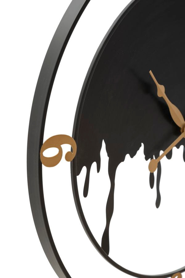 Moderne Wanduhr aus Metall in Gold und Schwarz