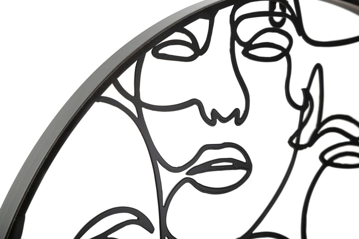 Schwarze Wanduhr mit abstrakten Gesichtern aus Metall