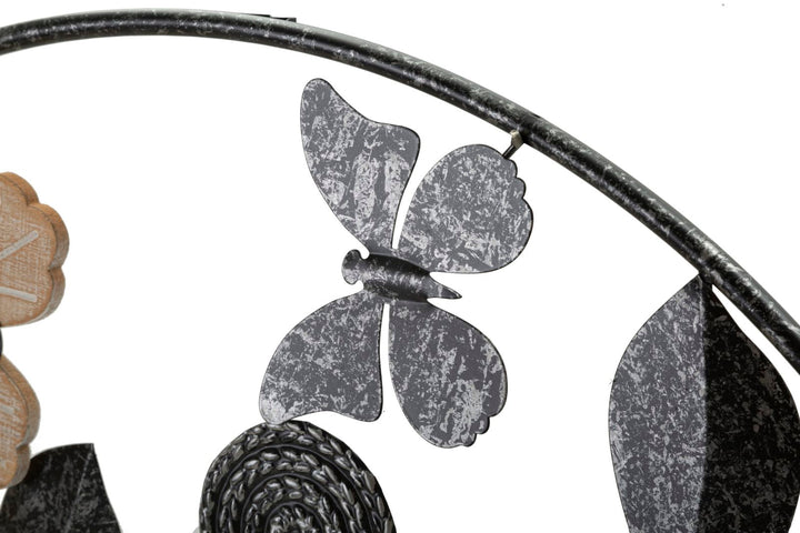 Schwarze Metall- und Holz-Wanduhr mit Blumenmuster