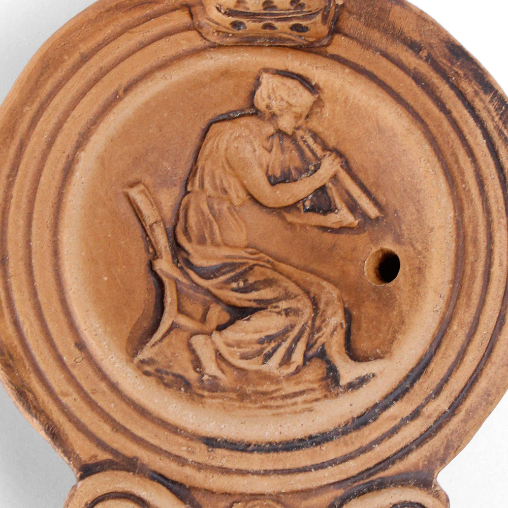 Römische Öllampe mit Frauenfigur
